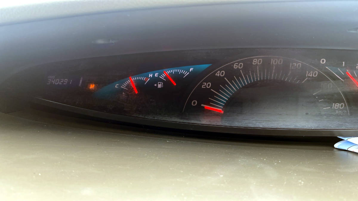 Dashboard with orang M light on